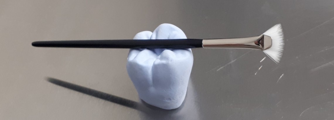 Fan brush on tooth model